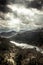 Dark moody mountains landscape in autumn season around canyon with Rijeka Crnojevica river curve from high view in overcast day w