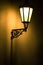 Dark moody picture of old lamp on