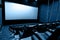 Dark movie theatre interior with screen