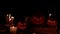 Dark mystical table with Jack pumpkins and candles camera on Dolly