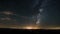 Dark night starry sky with stars and milky way galaxy over nature landscape Astronomy Time lapse
