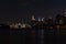 Dark Nighttime Roosevelt Island and Manhattan Skyline along the East River in New York City