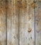 Dark old retro weathered knotted wood fence boards planks vintage architectural background
