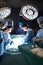 Dark operating room and surgeons