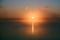 Dark orange dawn on the big lake, sunrise