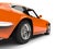 Dark orange vintage race fast car - rear wheel closeup shot