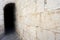 Dark passage with antique stone wall