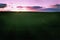 Dark picture of emotional sunset over the horizon verdant fields in Ceske stredohorie in bohemian landcape