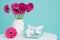 Dark pink gerberas in a vase on a retro table. Happy Mother`s Day, Women`s Day, Valentine`s Day or Birthday background.