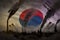 Dark pollution, fight against climate change concept - factory chimneys heavy smoke on Republic of Korea South Korea flag