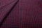 Dark purple checkboard pattern shirt fabric background, garment texture with buttons holes