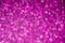 Dark purple defocused glitter lights background. Rounded defocused lights. Abstract bokeh background with copy space and