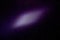 On a dark purple fine-grained background, a light purple cloud of light