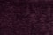 Dark purple fluffy background of soft, fleecy cloth. Texture of light nappy textile, closeup.