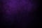 Dark purple grungy background with spotlight