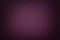 Dark purple leather texture background, closeup. Violet cracked backdrop from wrinkle skin