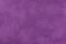 Dark purple matte background of suede fabric, closeup. Velvet texture of textile