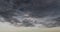 Dark rain cloud dramatic sky summer tropical thunder storm sky and fluffy black darkness cloud nearly raining cloudscape. Nimbus