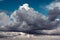 Dark rain clouds on a blue sky for background