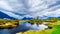 Dark rain clouds on a cold spring day at over the Pitt River and the lagoons of Pitt-Addington Marsh in Pitt Polder at Maple Ridge