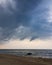 Dark rain clouds moving across coastline