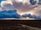 Dark, rainy clouds above the plain.