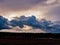 Dark, rainy clouds above the plain.