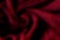 Dark red and black blurred abstract gradient twisted wave background