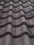 Dark red brown heavy thick concrete roof tiles