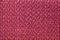 Dark red wicker textile background. Structure of the purple woven fabric