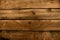 Dark rustic brown wood uneven planks flatlay background