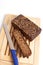 Dark rye bread whith knife on a board