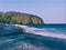 Dark sand beach and seaside with distant mountain? digital illustration