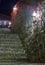 Dark scene with night medieval stairs and street lights