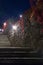 Dark scene with night medieval stairs and street lights