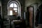 Dark and shabby messy kitchen in poor apartment of old emergency house