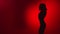 Dark shadow of woman go go dancer performing dance show on red slowmo. Shot with RED camera in 4K