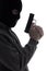 Dark silhouette of burglar or terrorist in mask with gun isolate