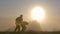 Dark silhouette of a man having fun outdoors at sunrise.