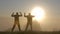 Dark silhouette of a man having fun outdoors at sunrise.