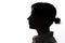 Dark silhouette of a young girl on white background, the concept of anonymity