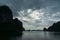 Dark silhouettes of karst islands of Halong Bay on dusk