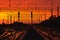 Dark Silhouettes Railway Infrastructure In Dramatic Sunset Backl