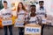 Dark-skinned teenager holding box with paper after sorting