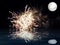Dark sky with full moon and fireworks in sea reflection