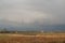 Dark Sky over Rural Landscape with Dutch Mill