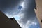 Dark storm clouds over residential houses.