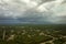 Dark stormy clouds forming on gloomy sky before heavy rainfall over suburban town area