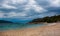 Dark stormy clouds gather above a popular windsurfing beach in Peljesac, Croatia