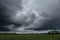 Dark, swirling, threatening clouds in the sky.